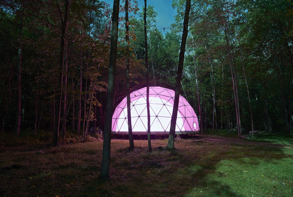 A dome lit up at night