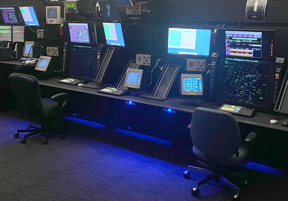 A view of computer monitors inside an air traffic control center.