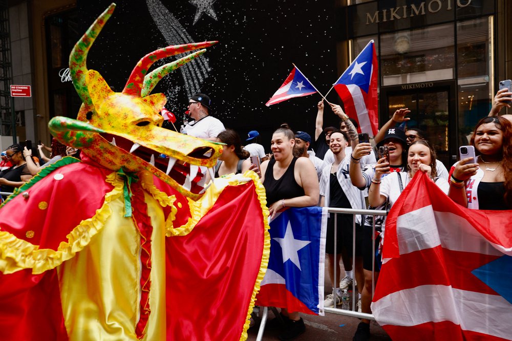 An image of costumed revelers and onlookers from the Puerto Rican Day Parade in Manhattan, two years ago.