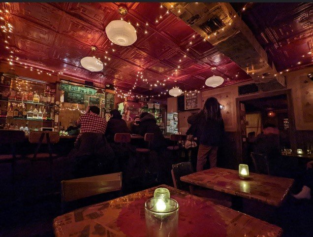 The interior of a dark bar.