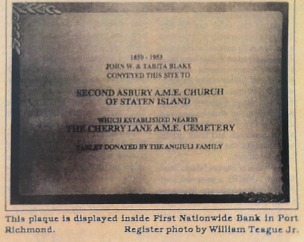 A vintage photograph of a plaque that acknowledges the Cherry Lane cemetery.