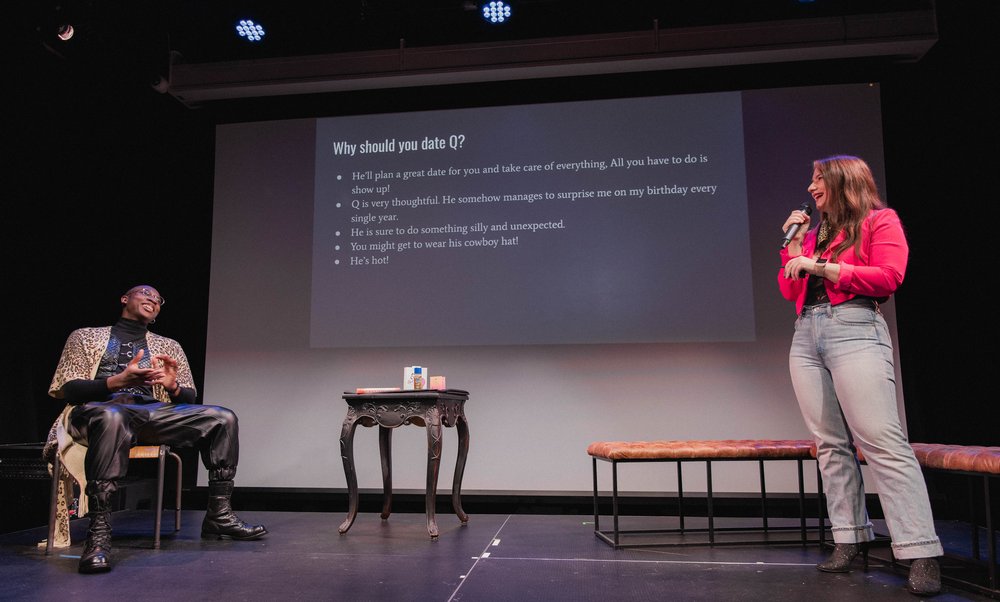 A person onstage makes a presentation.