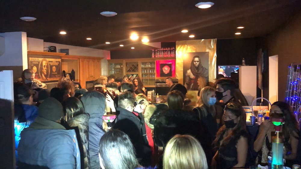 A crowd of partygoers inside an apartment in Manhattan on January 1st, 2021.