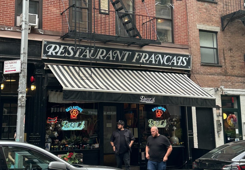 The exterior of a French restaurant.
