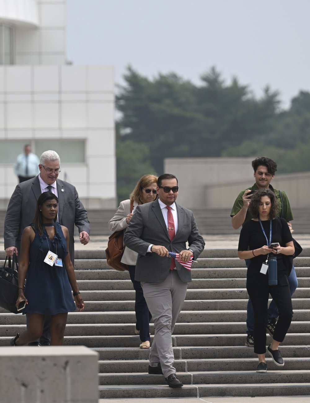 A photo of George Santos leaving federal court in May