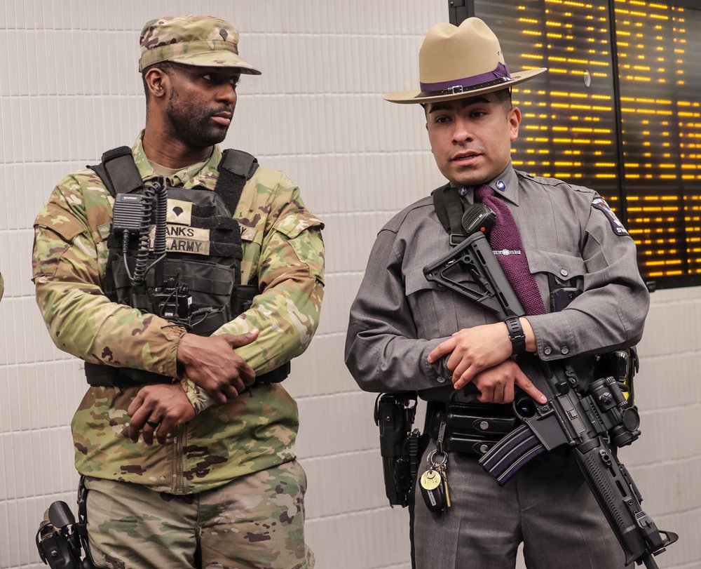 A photo a state trooper and National Guardsman in the subways.