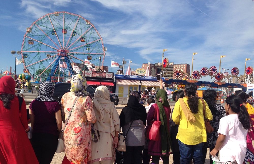 12 Sakhi community members are gathered at Coney Island for a Sakhi program.