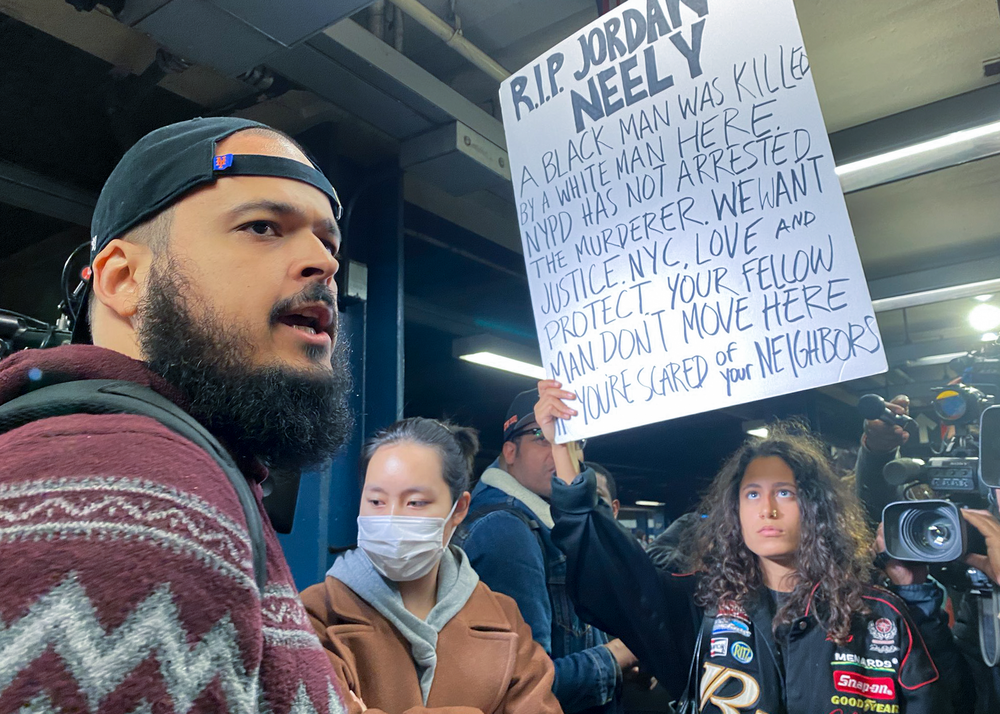 A photo of protesters gathered on the subway platform where a man died after being placed in a chokehold by another passenger