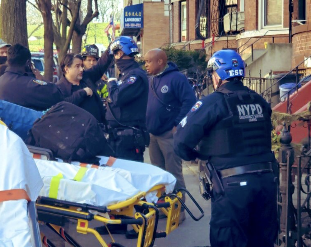 A stretcher outside the Sunset Park home on 42nd Street, near 5th Avenue