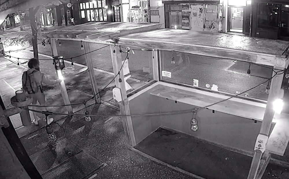 Surveillance footage of the alleged fire-starter at Prince Street Pizza