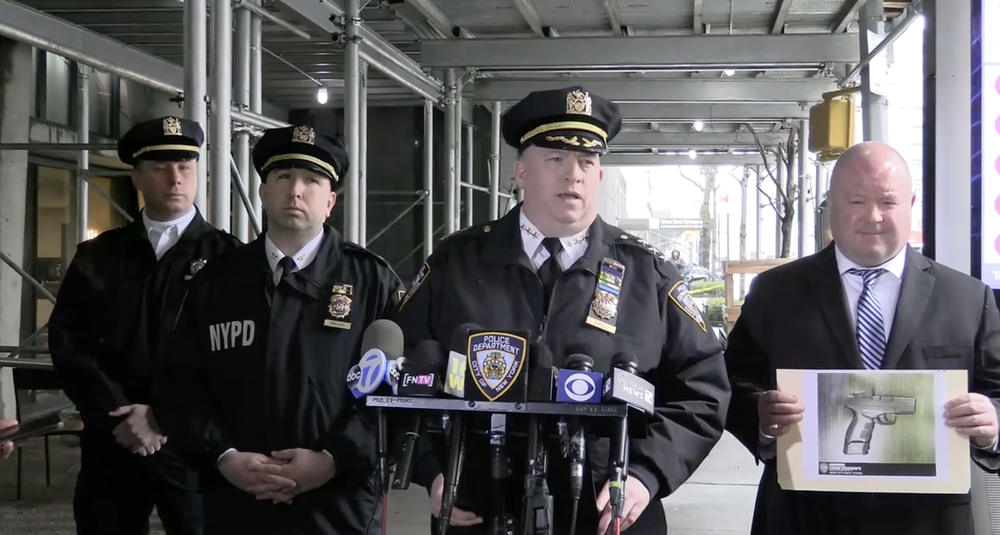 A photograph of NYPD officers briefing reporters after a March 14th shooting on the Upper West Side.