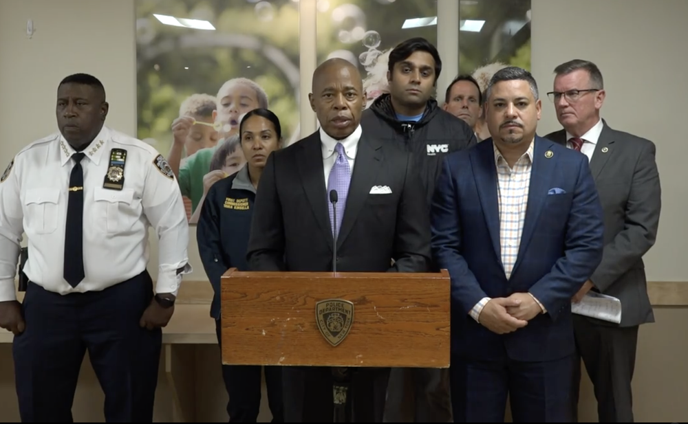 A photo of Mayor Eric Adams, police and administration officials briefing reporters at Montefiore medical center after a child died due to opioid exposure.