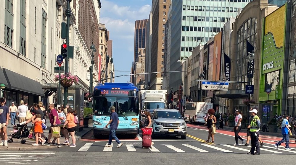 People crossing 34th Street.