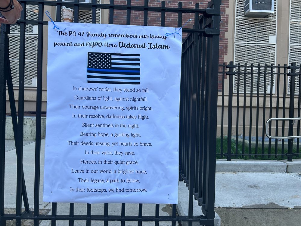A sign posted across the street from the Bronx home of Police Officer Didarul Islam.