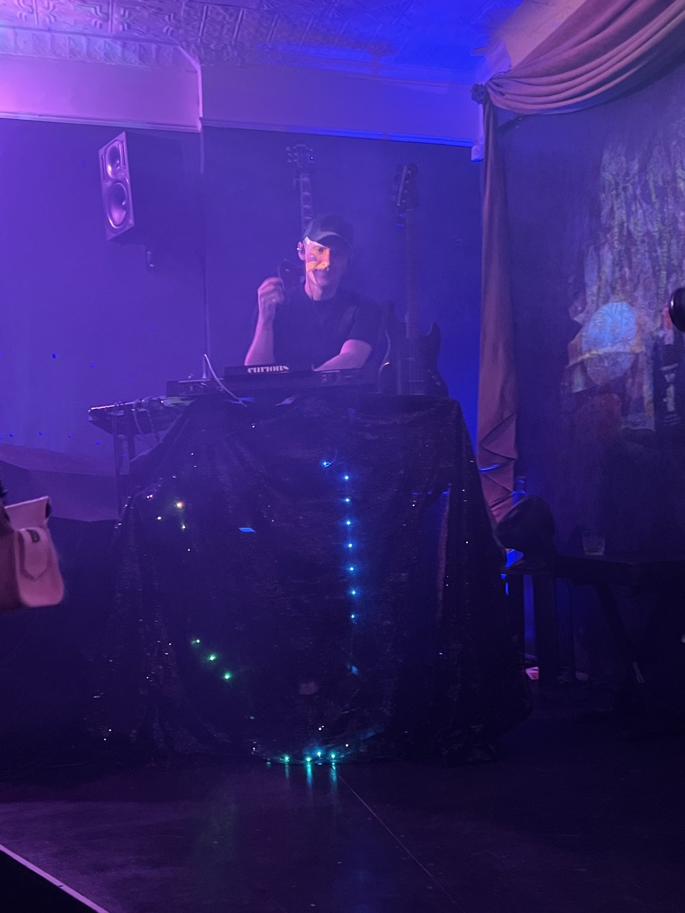 a DJ in a dark room