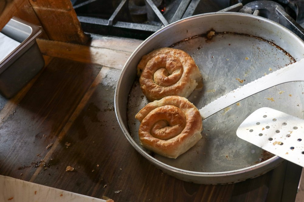 A roll of white bread shaped into a coil.