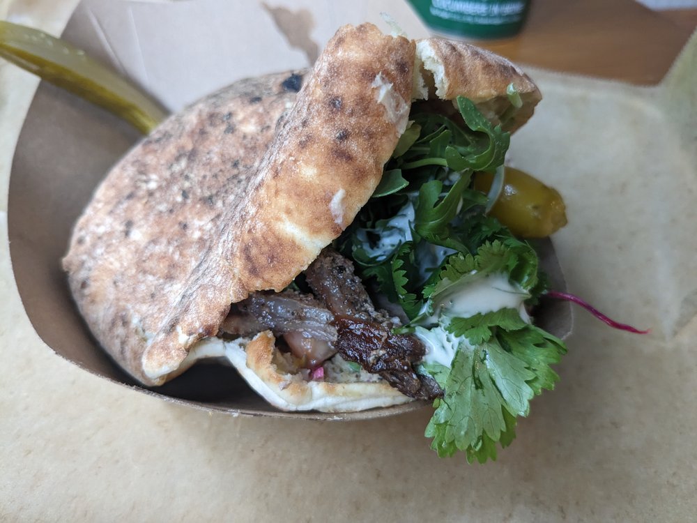 A sandwich in pita with meat.