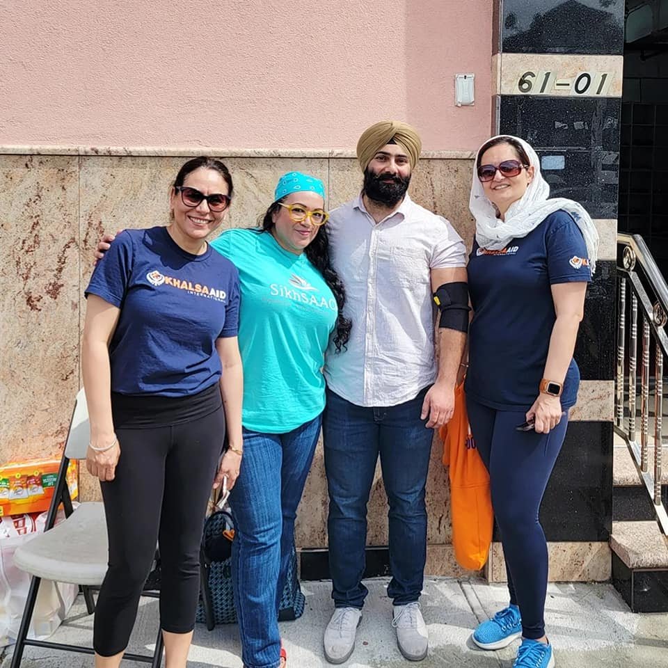 Stevie Kaur (second from left), founder of SikhSAACH, and other advocates at a gurdwara resource fair in Woodside, Queens in April 2023.