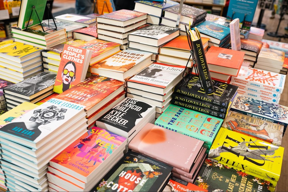 A table lined with books