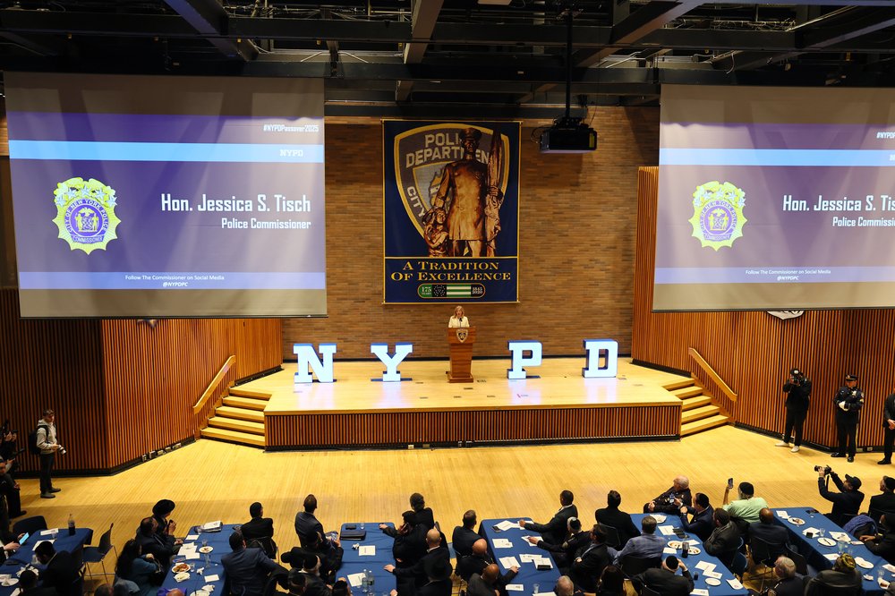 A photo of NYPD Commissioner Jessica Tisch addressing a cavernous room of officials during a recent address.