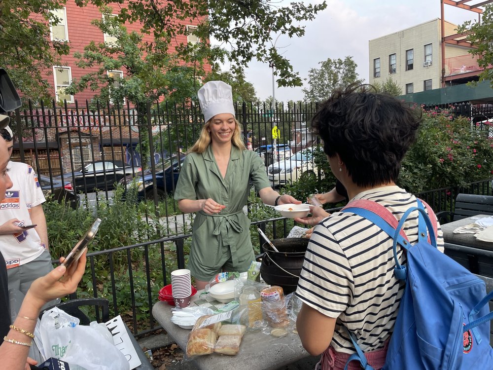 A woman with a white chef's hat.