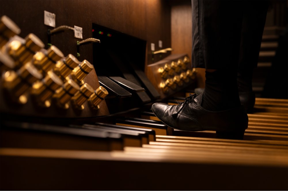 A foot plays the pedals of Trinity Church's new organ