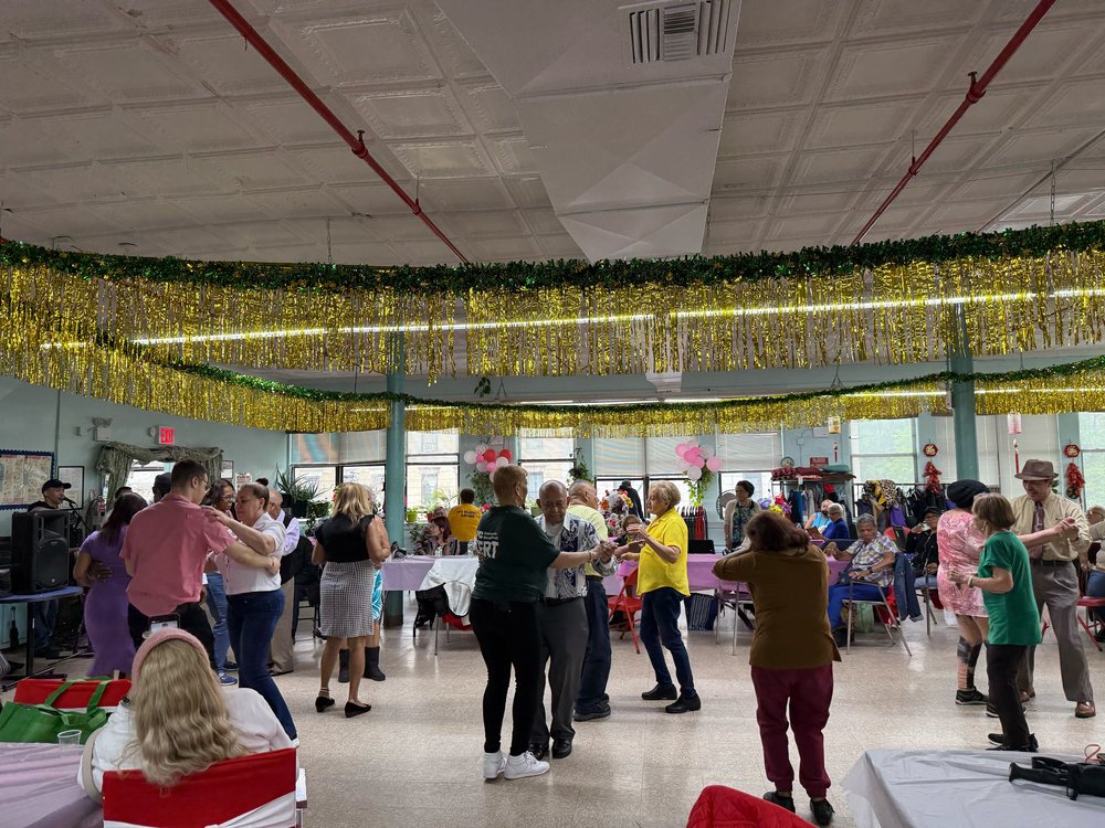 A photo of people celebrating the United Senior Center