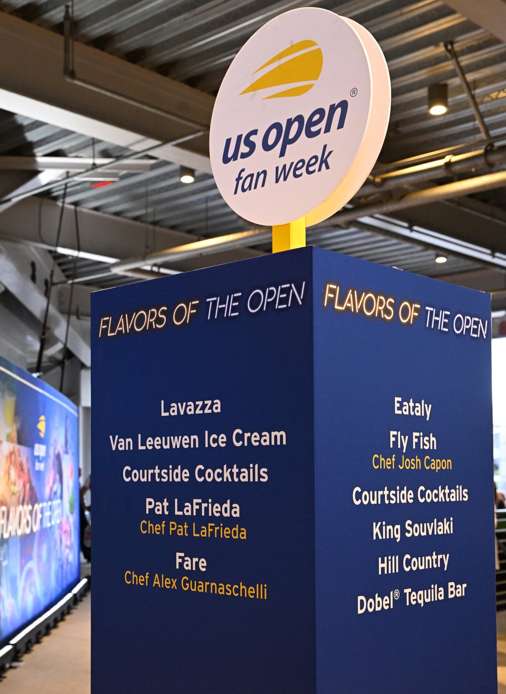 A blue sign announcing the listings at last year's Fan Week.