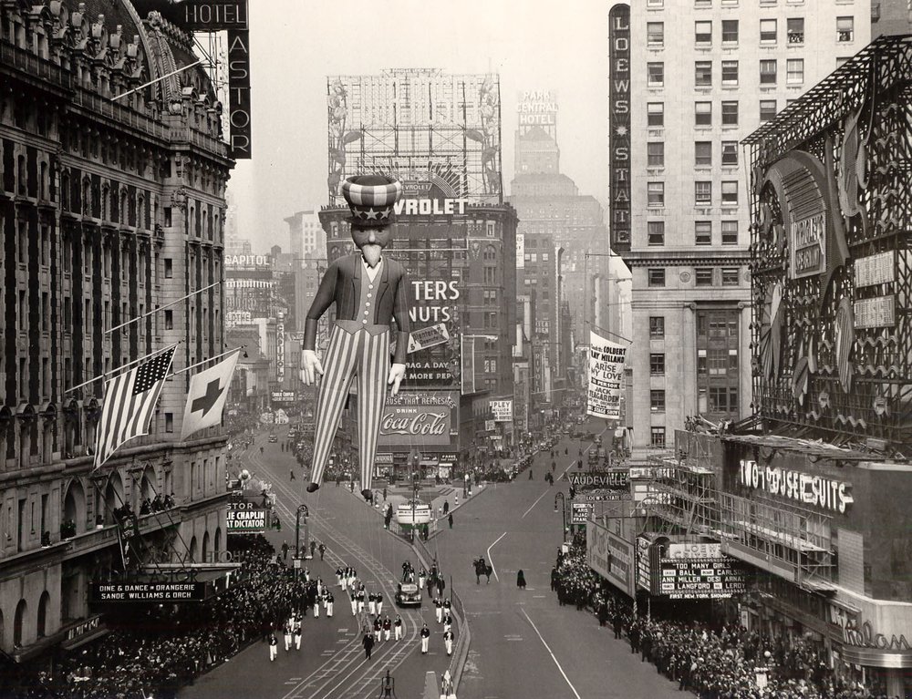 A black and white picture of the Macy's Thanksgiving Day Parade from the 1940s.