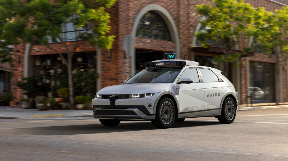 A waymo car on a street without a driver.