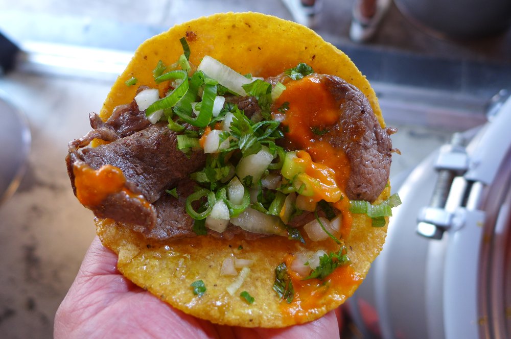 A taco with steak inside.