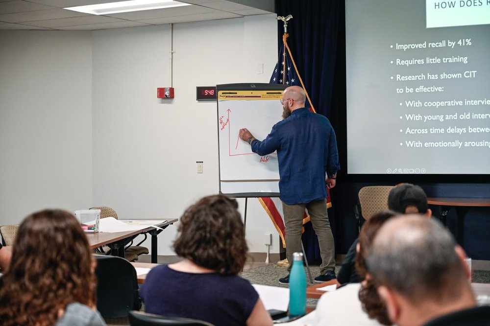 Researcher and former intelligence officer Wayne Thomas teaches staff at the Manhattan district attorney's office about science-based interviewing at a training in July.