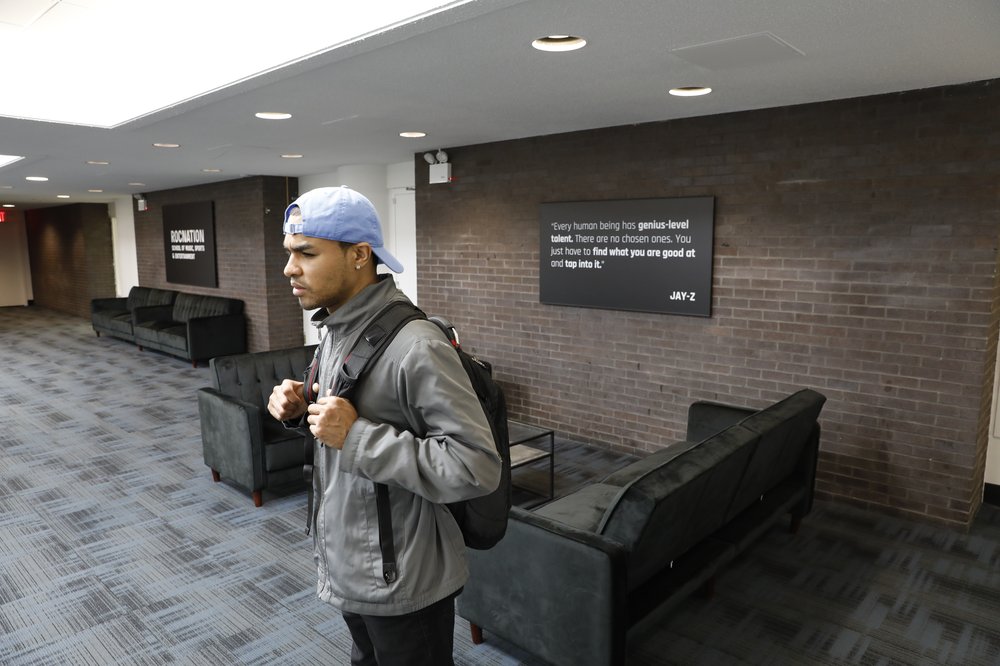 A young man in a student lounge.