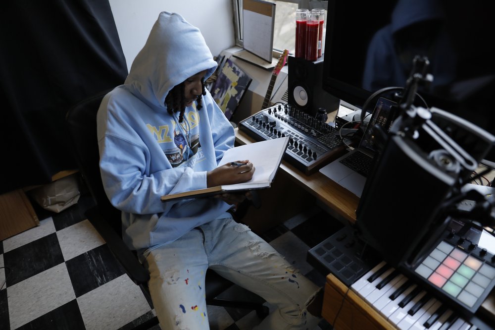 A student writes in a book.