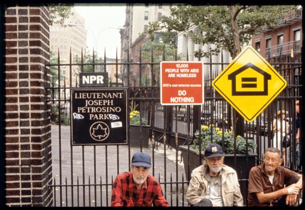 a50d1d9a318-gran-fury-petrosino-1990-nypl-jpg.jpeg Gran Fury, Petrosino Park Installation (Do Nothing and Stall with men), 1990, Petrosino Square, Manhattan, Manuscripts and Archives Division, The New York Public Library. An artists' collective devoted to AIDS activism, Gran Fury was born out of ACT UP (AIDS Coalition to Unleash Power). This team of artists used the commercial language of posters, billboards, ads, and flyers in predominantly public spaces to pressure society and public figures to address the AIDS epidemic.<br/>