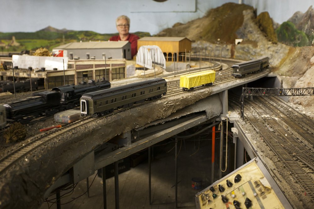 a695a03caimg_1711-jpg.jpeg Throughout the set, there are cut-outs where you can stand and watch the trains go around you. Controllers would sit at each position and pilot the trains around the track using the controls, seen at bottom right.