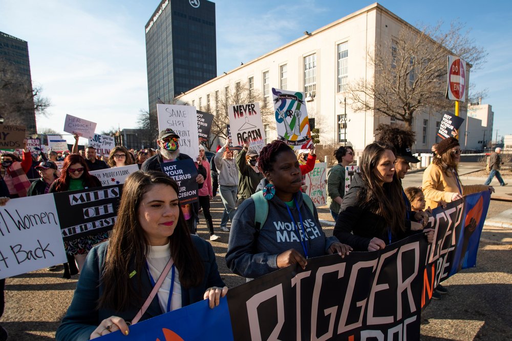 People march in front of the J. Marvin Jones Federal Building and Mary Lou Robinson United States Courthouse to protest a lawsuit to ban the abortion drug mifepristone, in Amarillo, Texas, Feb. 11, 2023.