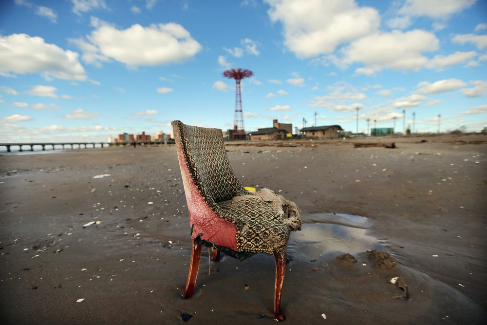 ac2a33f60gettyimages-155356446-jpg.jpeg A damaged chair sits on the beach in low-lying Coney Island in the wake of Superstorm Sandy on November 3, 2012. <br/>
