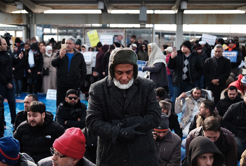aedb2628fgettyimages-633701124-jpg.jpeg Muslim men pray at a prayer and demonstration at JFK airport to protest President Donald Trump's immigration ban, February 3, 2017 <br>