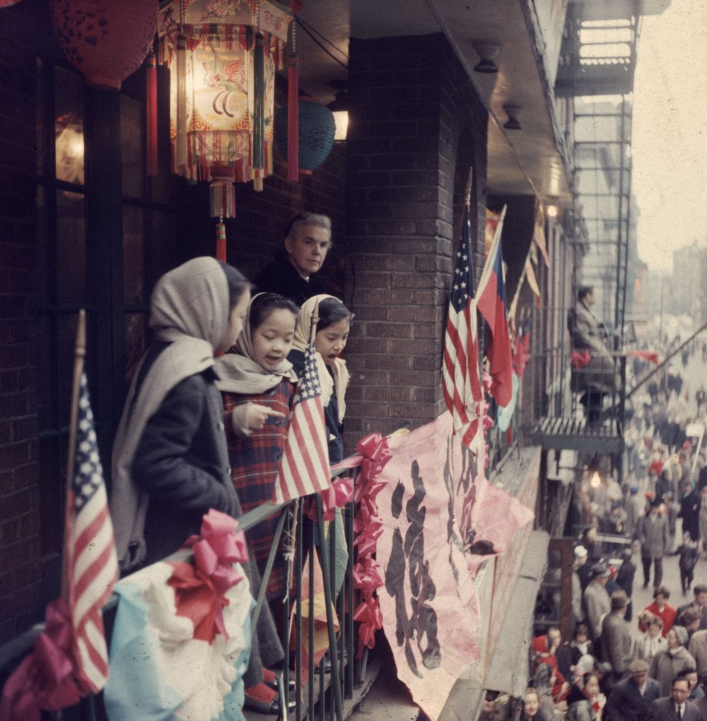b0a622b95.jpeg "Chinese and American flags fly in the streets of Chinatown, New York, during the Year of the Rat. February 1960."