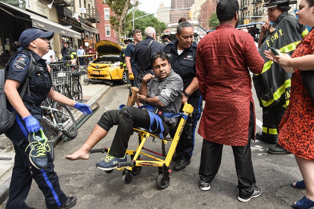 b76ac8cf3shutterstock_10332465c-jpg.jpeg An injured person is wheeled away by EMT<br>