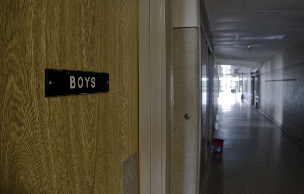 the door to the boys' bathroom in a school