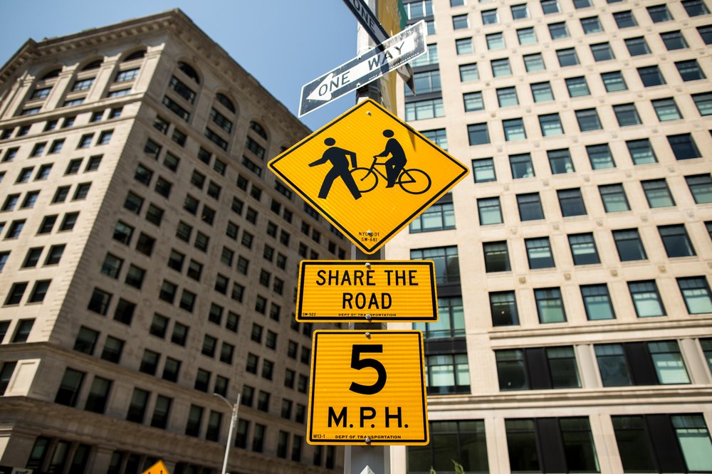 bcd15359a080917newsafestreetsflatiron-11-jpg.jpeg Signs alerting pedestrians, cyclists, and drivers to the new street rules near Broadway and West 24th Street.</br>