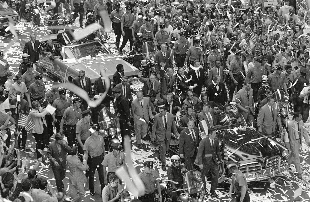 bd2ebdc7cshutterstock_6638811a-jpg.jpeg Edwin Aldrin, Michael Collins, Neil Armstrong Apollo 11 astronauts wave from lead car of motorcade to crowd massed on both sides of the street during parade up lower Broadway in August 1969 (Rh/AP/Shutterstock)