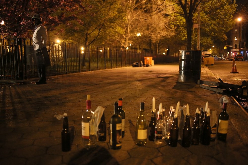 bdf1b31a6.jpeg An actor in riot gear stands near a collection of candles and bottles which are presumably Molotov Cocktails, although more than one passerby yelled that they should be bottles of urine, for accuracy's sake.<br/>