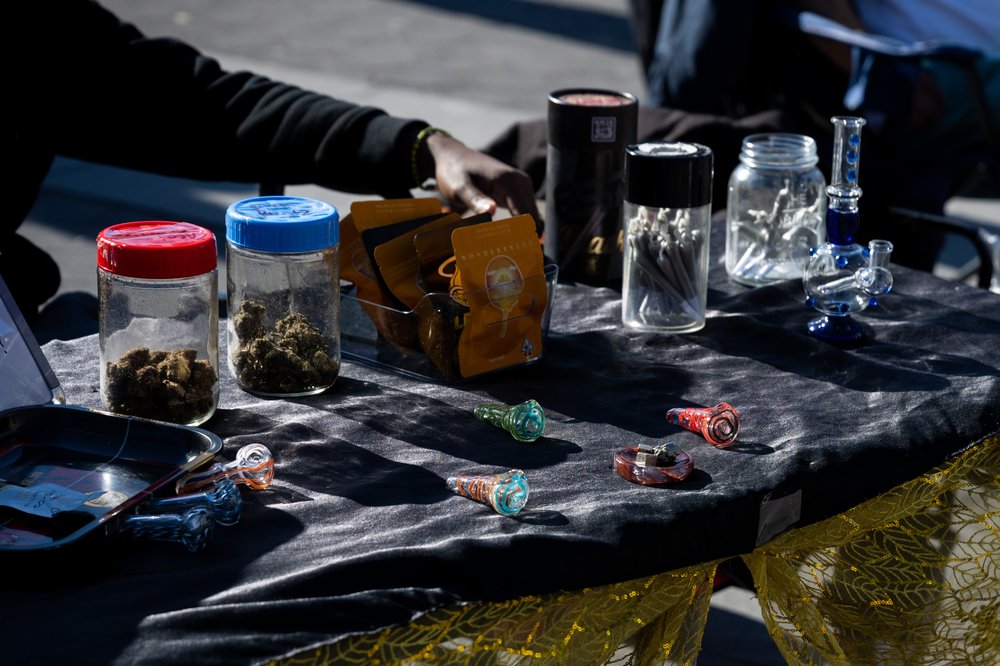 A marijuana vendor sells flower and pre-rolled joints in Washington Square Park during the first weekend of spring on March 26, 2023.