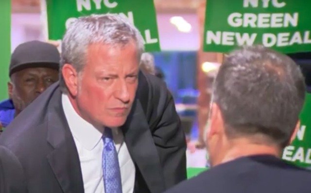Questions for the mayor were hard to make out over the protesters who crashed de Blasio's Trump Tower rally on Monday.
