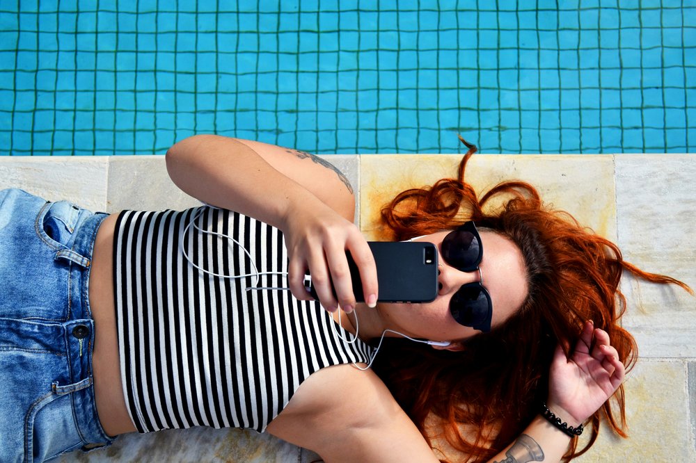 Woman listening to music laying down.