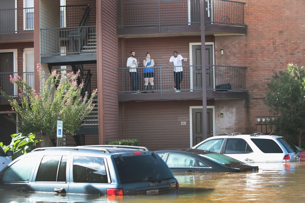 Residents wait for rescue at an apartment complex after it was inundated with water following Hurricane Harvey on August 30, 2017 in Houston, Texas<br>(Getty Images)