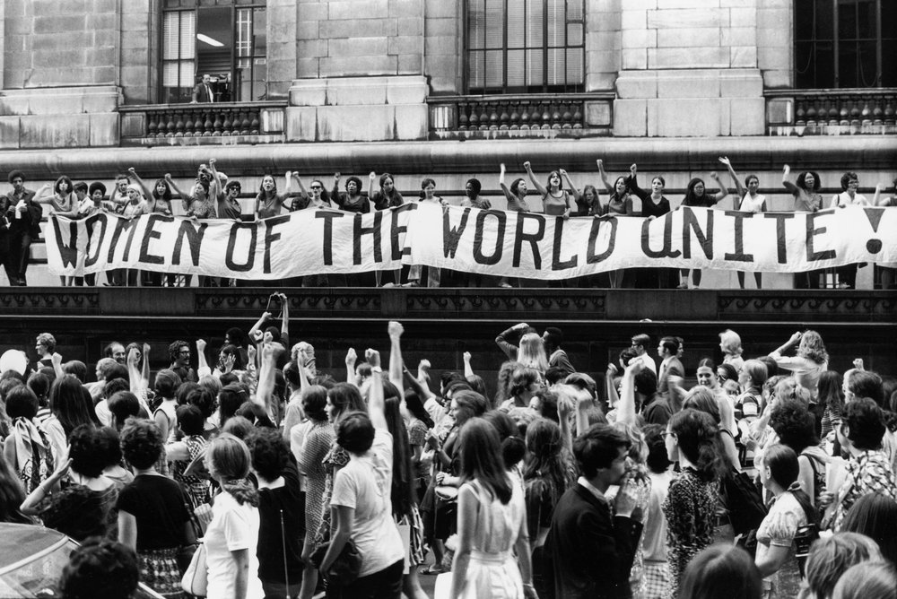 c1b012361186-august-26-1970-women-of-the-world-unite-jpg.jpeg To commemorate the fiftieth anniversary of women’s suffrage in the United States, an estimated twenty thousand women march along Fifth Ave., here past a banner that reads, ‘‘Women of the World Unite!”, August 26, 1970<br/>